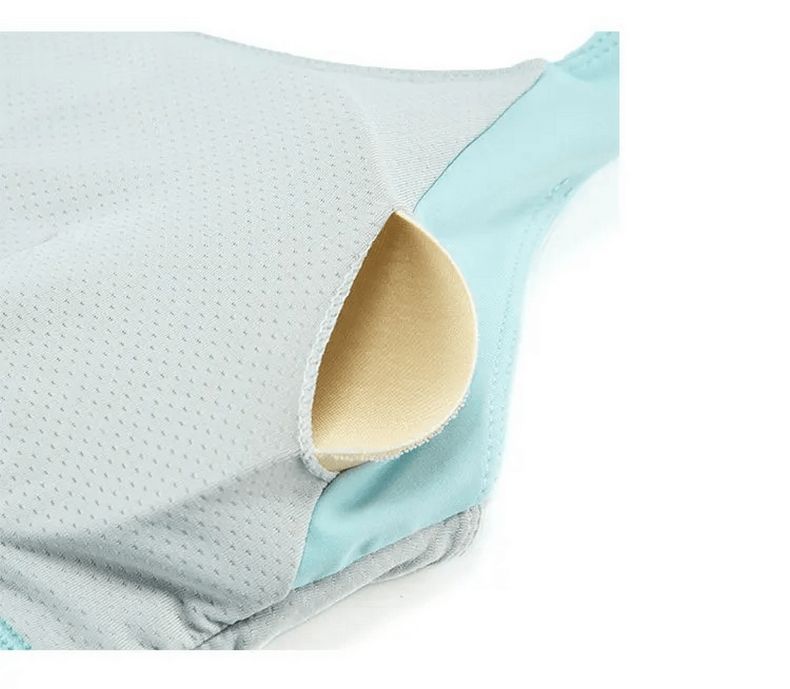 Close-up of breathable athletic clothing with padding detail, showcasing three-toned stylish design for women.